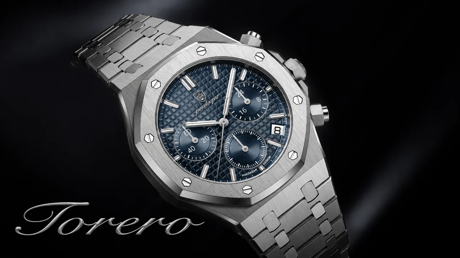 A steel octagonal chronograph with a blue tapisserie dial and an integrated bracelet, lit against black, the Torero script below it